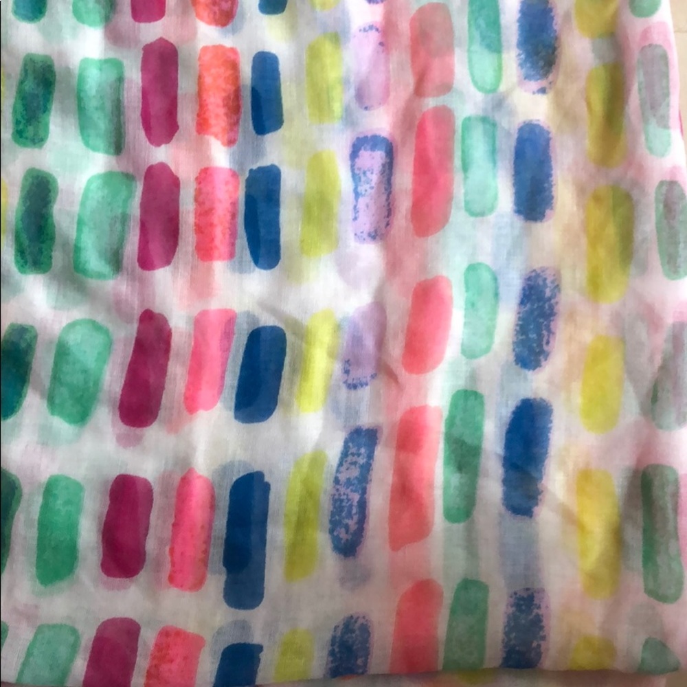 Multicolored Scarf with orange frills.